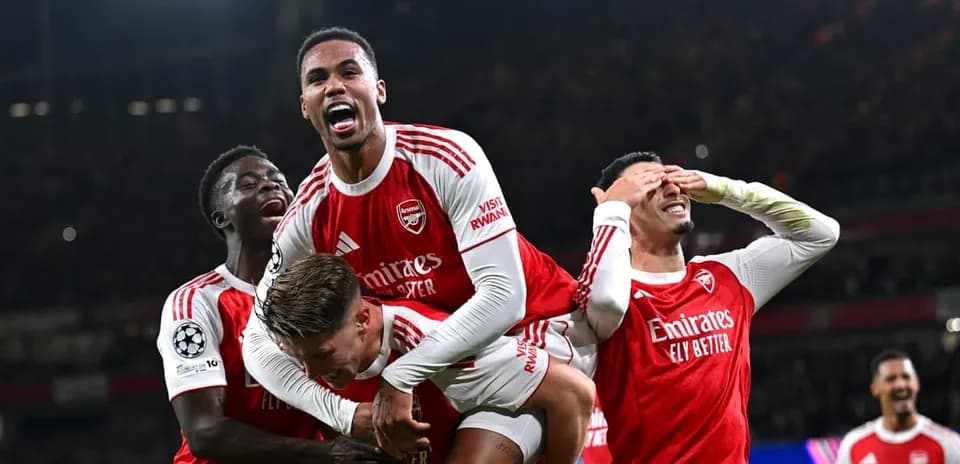 Arsenal players celebrating a goal in Champions League