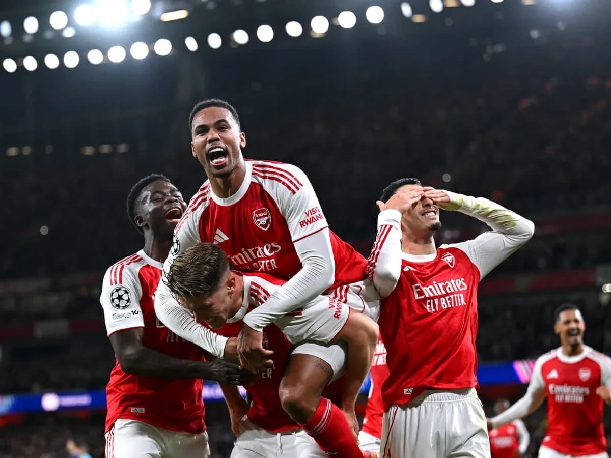 Arsenal players celebrating a goal in Champions League