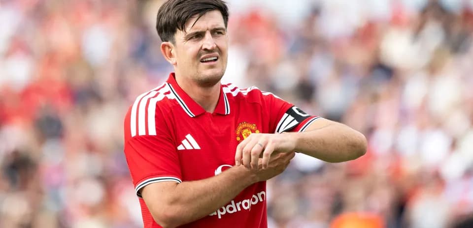 Player adjusting his wrist during match for Manchester United