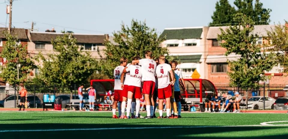 Players huddled together before the match