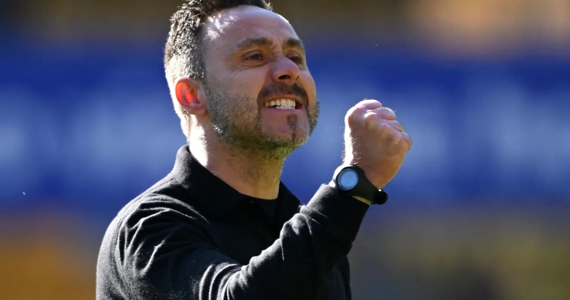 Coach celebrating with fist pump during match