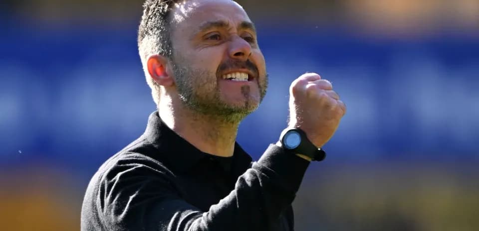 Coach celebrating with fist pump during match
