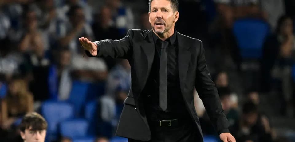 Coach gesturing during a football match
