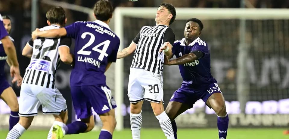 Players contesting for the ball in Europa League match