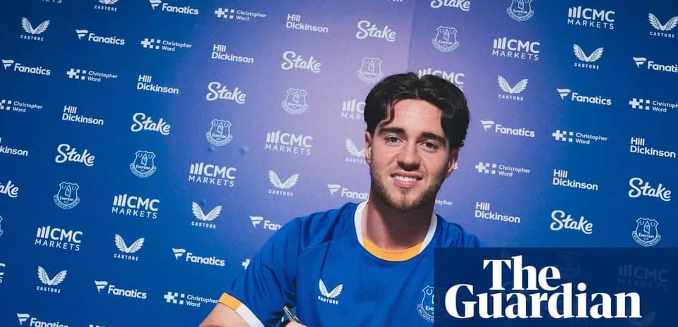Player signing contract at Everton press conference