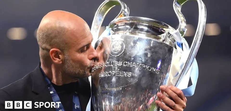 Coach kissing the UEFA Champions League trophy