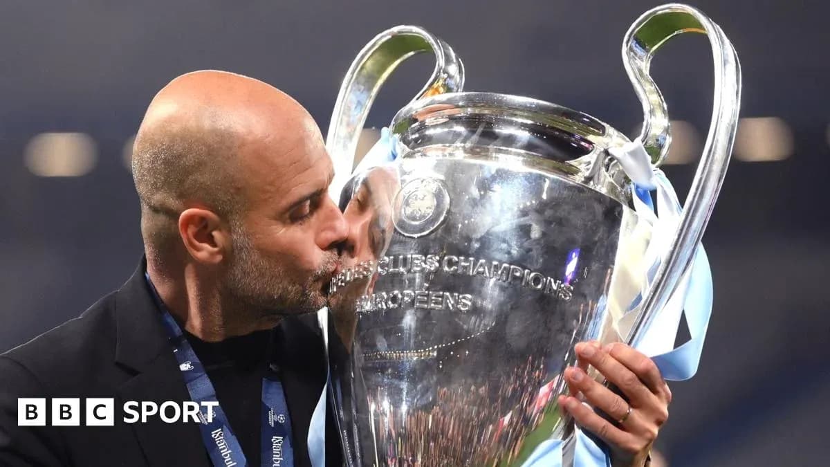 Coach kissing the UEFA Champions League trophy