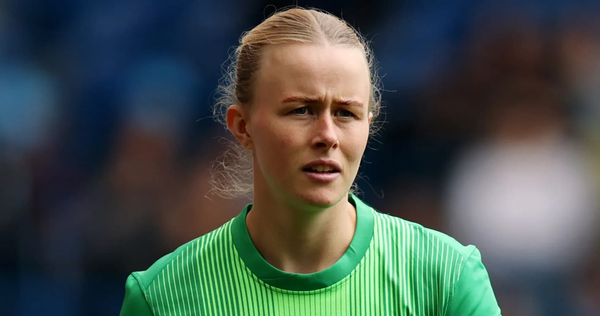Goalkeeper in green jersey during match preparation