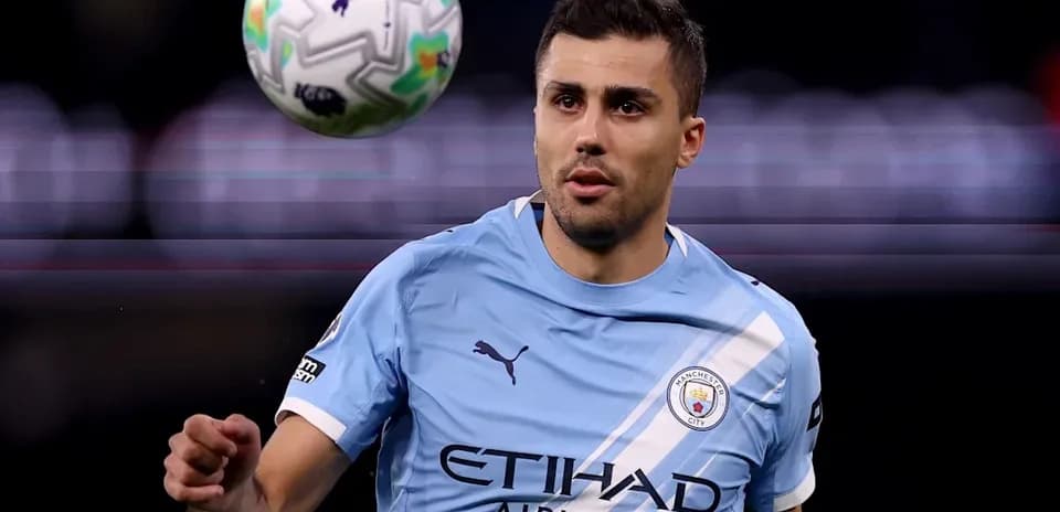 Player in light blue jersey controlling a football