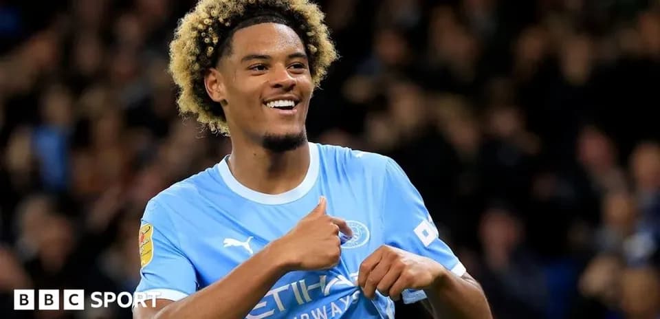 Player celebrating in Manchester City jersey