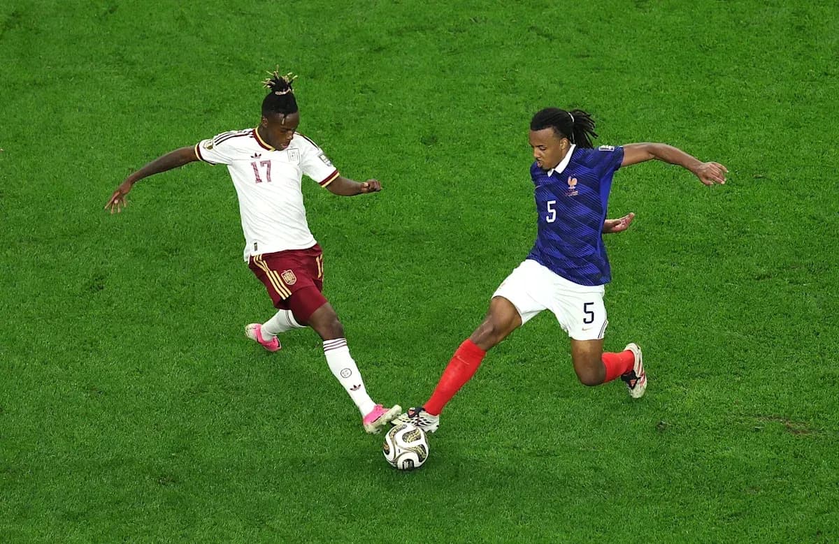 Two players competing for the ball during match