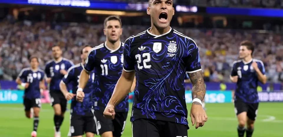 Argentina players celebrating a goal on the pitch