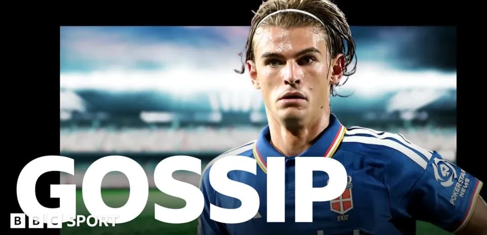 Player in blue kit with stadium background