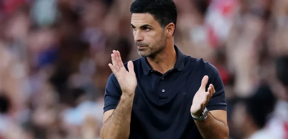 Coach applauding during a match on the sidelines
