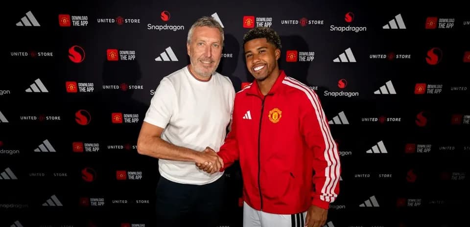 Two men shaking hands at a promotional event