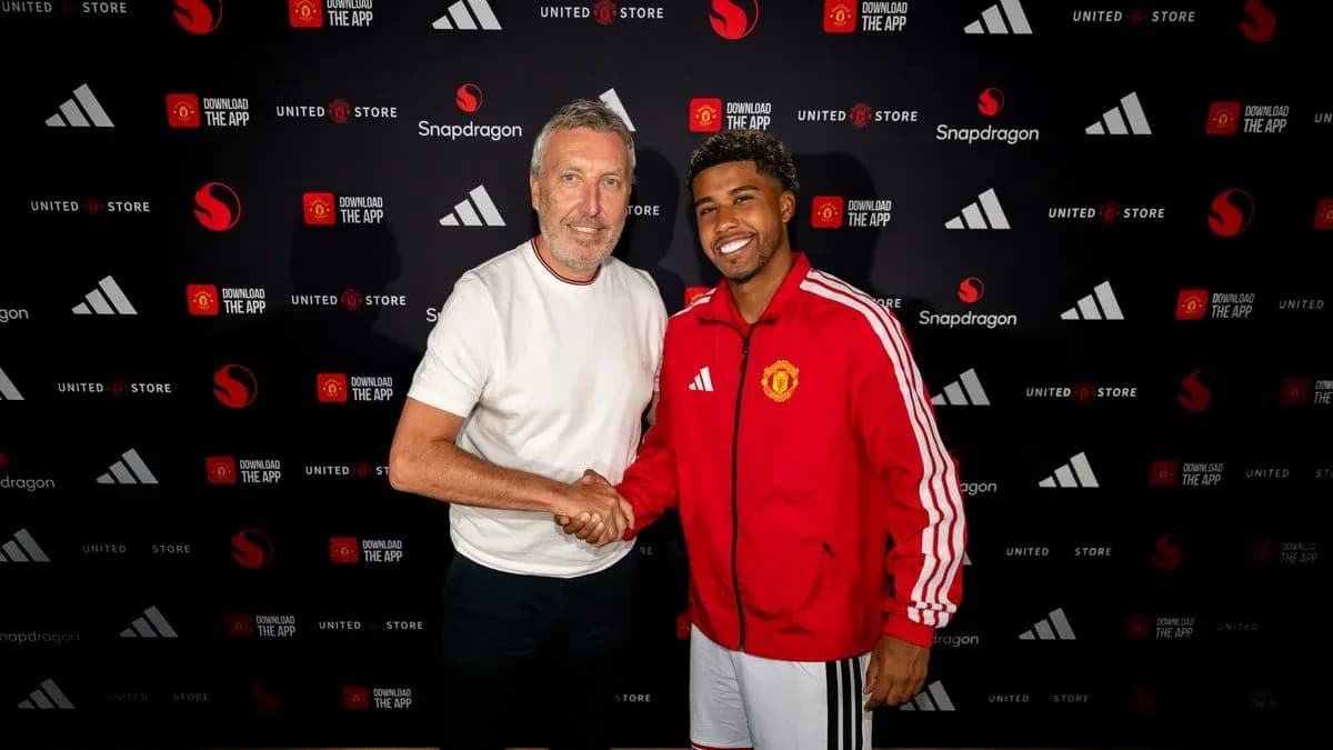 Two men shaking hands at a promotional event