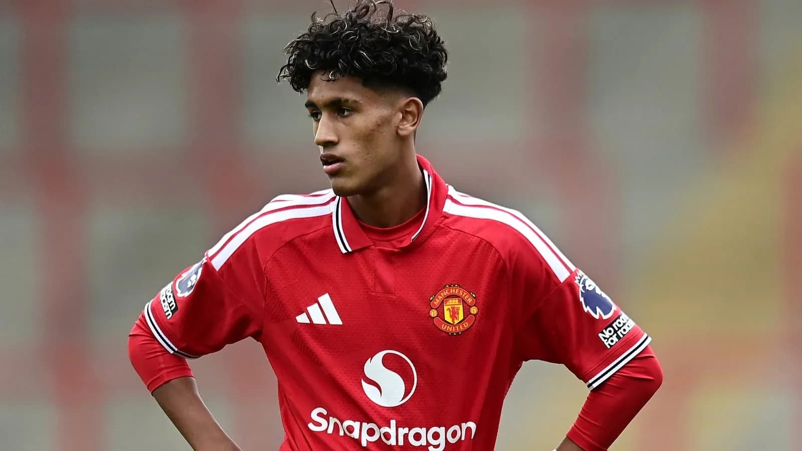 Young player in Manchester United jersey during match