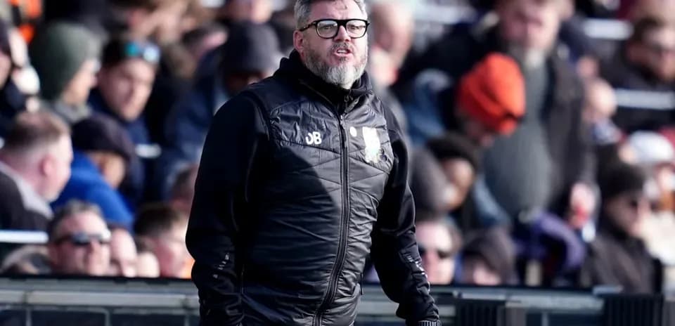 Coach on sideline during a football match