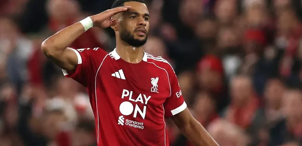 Player saluting fans during Liverpool match