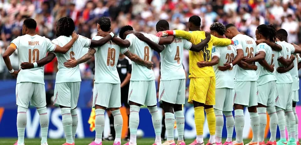 Team standing in solidarity before the match