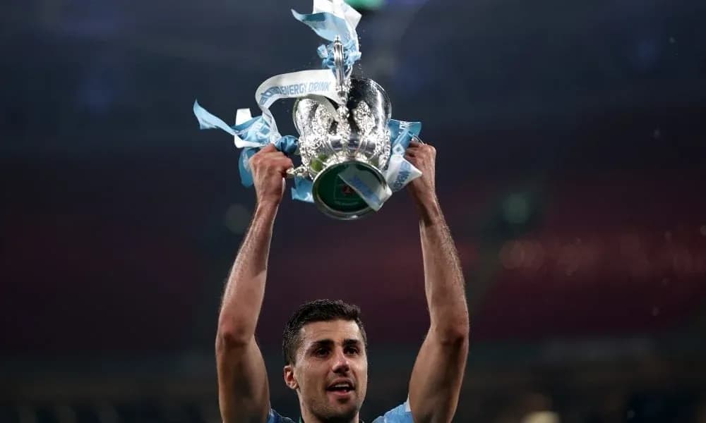 Player holding trophy aloft after winning match