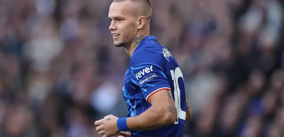 Player in blue jersey celebrating during match