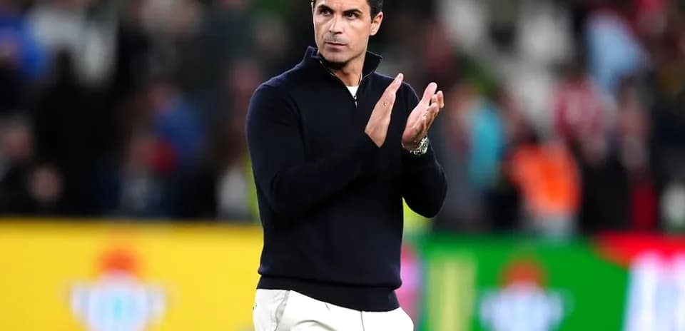Coach applauding after a match in stadium