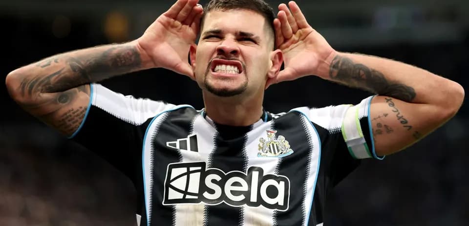 Player celebrating with hands on ears during match