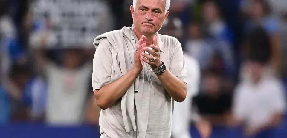 Coach applauding after the match on the field