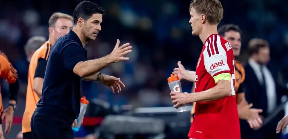 Coach discussing strategy with player during match