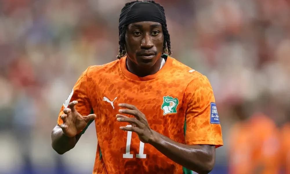 Player in orange jersey warming up before match
