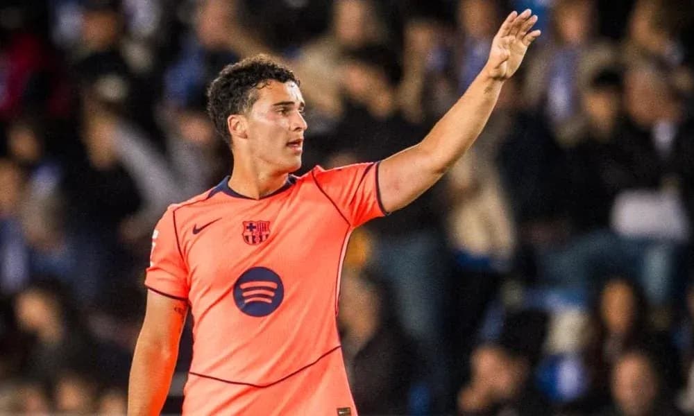 Player gesturing during match in orange kit