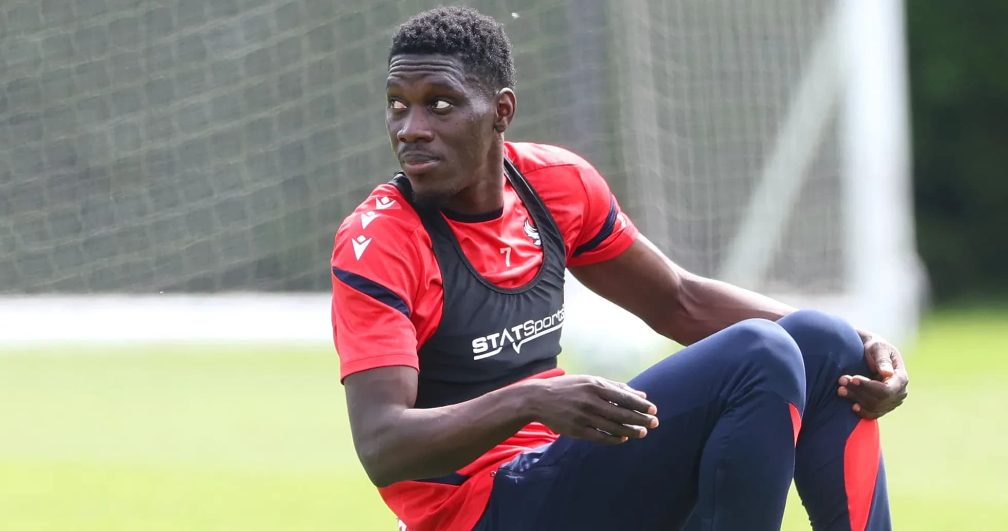 Player sitting on the training ground during session
