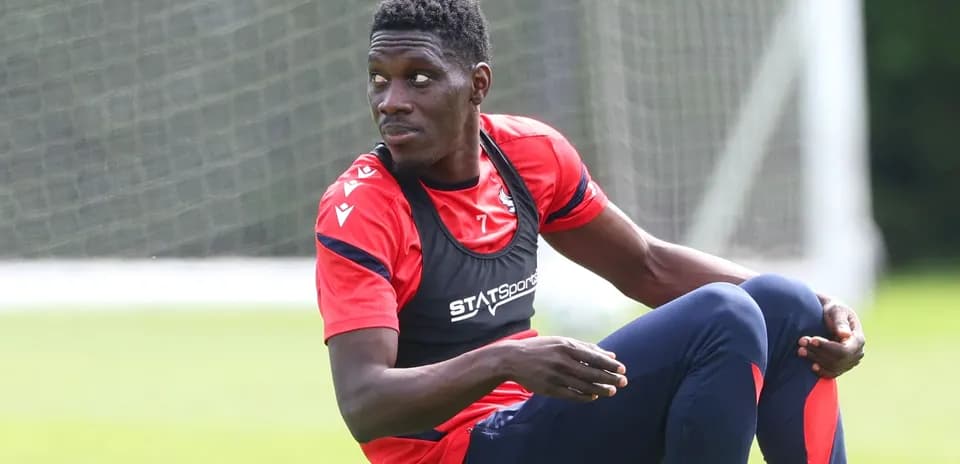 Player sitting on the training ground during session