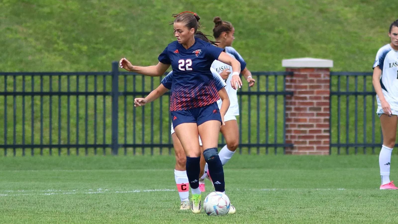 Player dribbling the ball during a soccer match