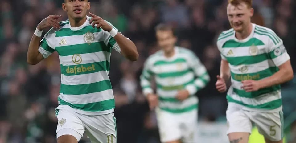 Celtic players celebrating a goal on the pitch