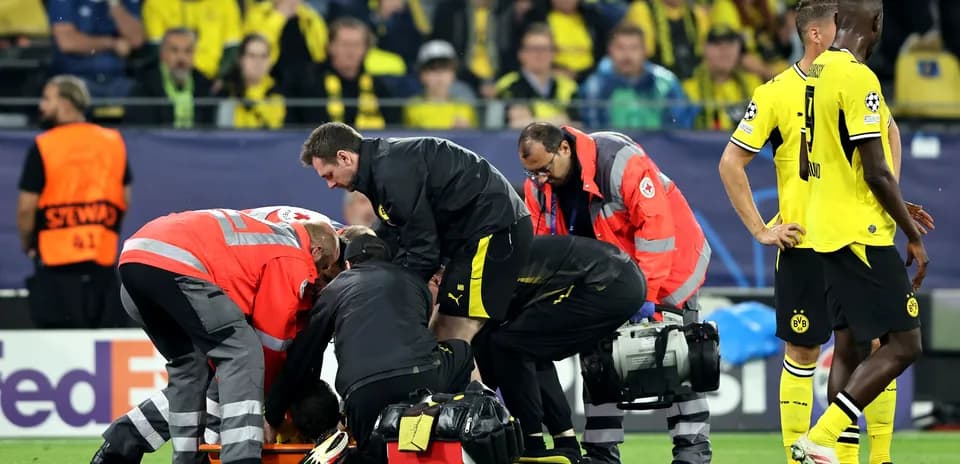Medical staff attending to injured player on field