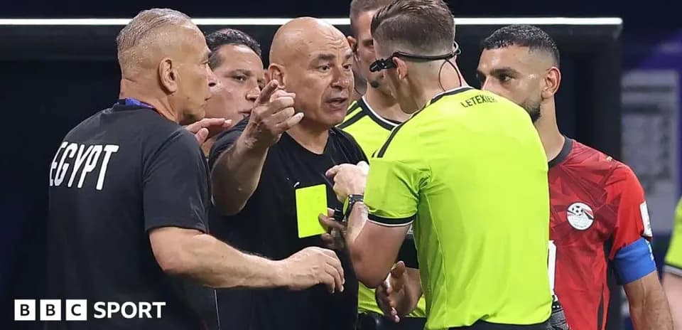 Coach and referee discussing during match controversy