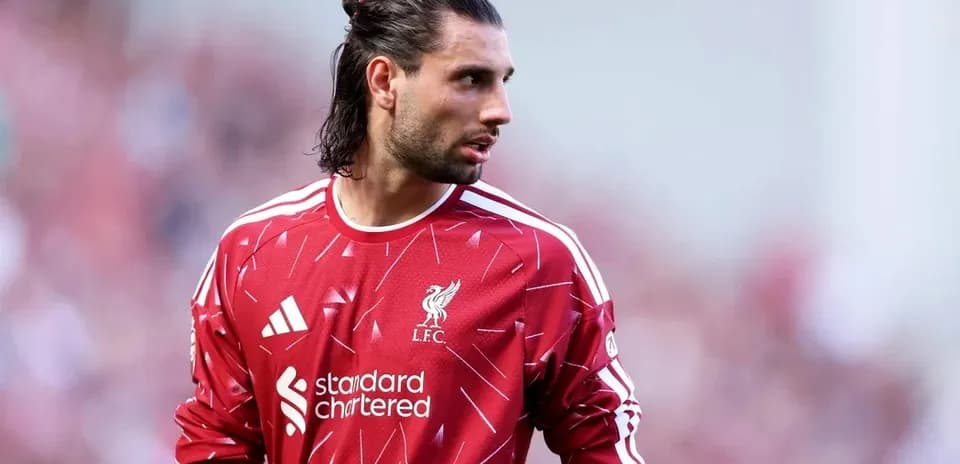 Goalkeeper in Liverpool kit during match warm-up