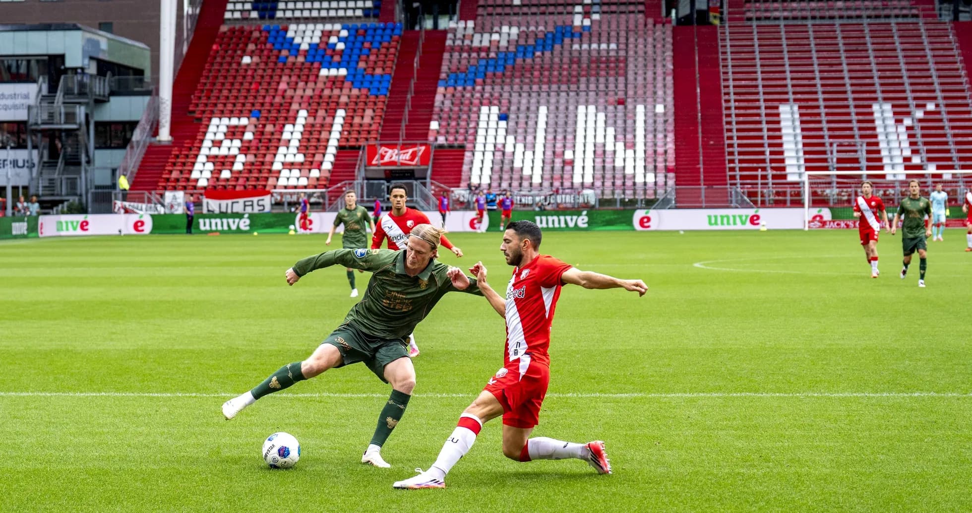 Two players challenging for the ball during match