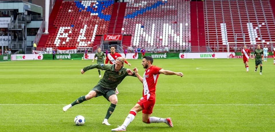 Two players challenging for the ball during match