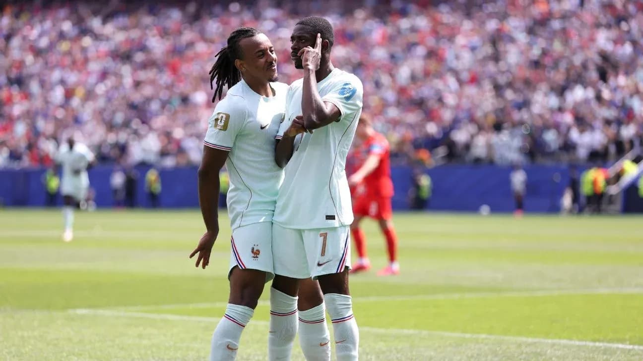 Two French players celebrating on the field