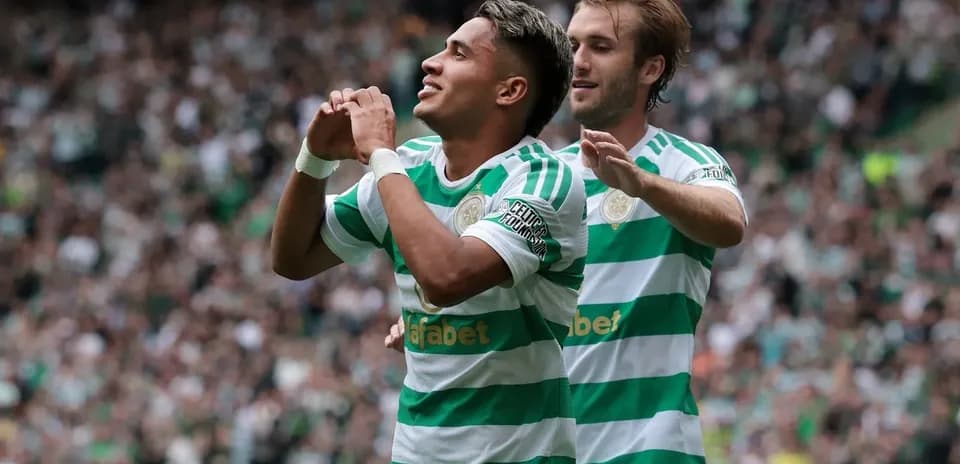Celtic players celebrating a goal in the stadium