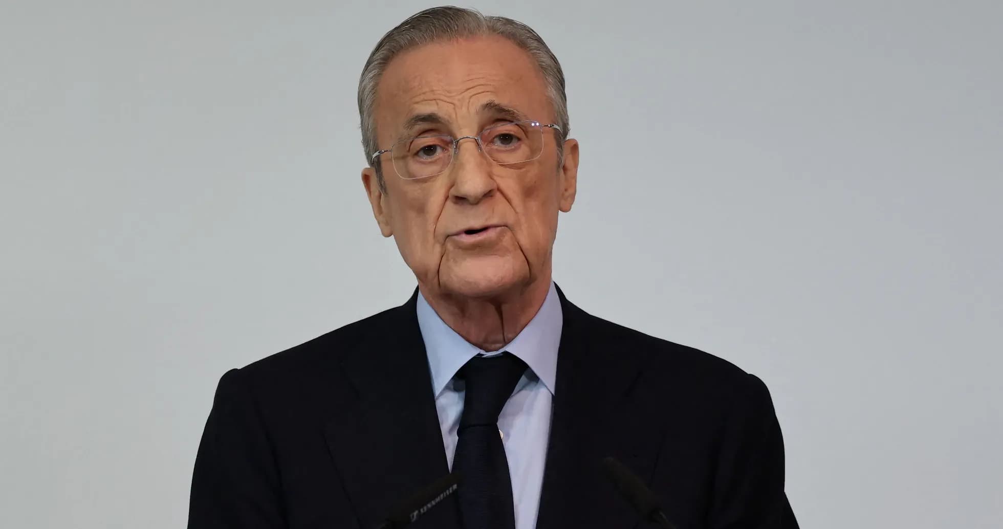 Man speaking at podium during press conference
