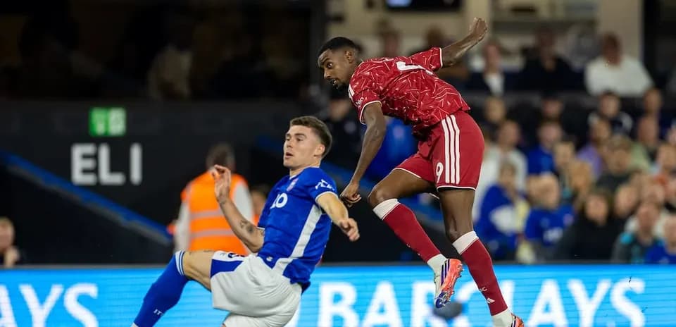 Player tackling during Ipswich vs Liverpool match