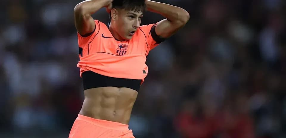 Player adjusting jersey during match at stadium