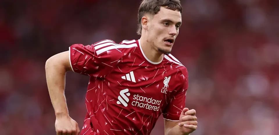 Player running during match in Liverpool kit