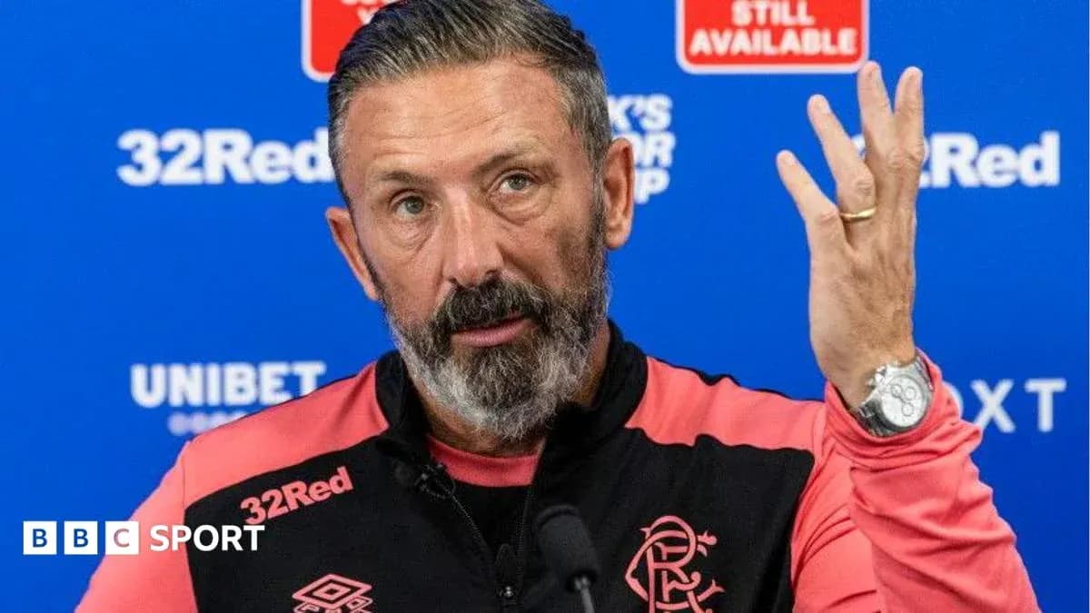 Manager speaking at press conference with team logo