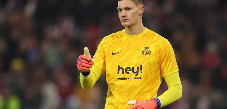 Goalkeeper in yellow kit giving thumbs up