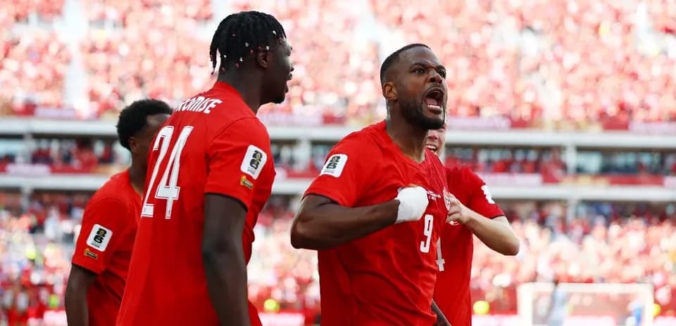 Canada players celebrating during World Cup qualifier
